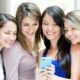 women sharing content on a phone
